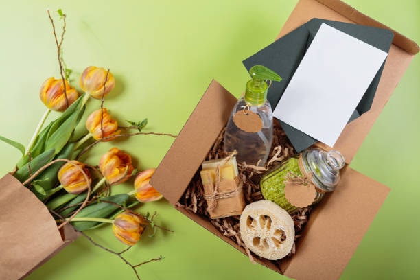 Eco-conscious gift box with natural soap bars, skincare jars, and fresh tulip flowers