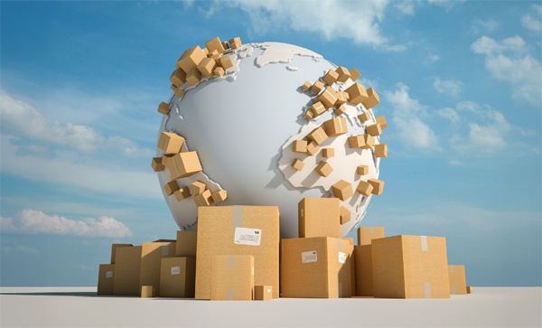 Global shipping concept with cardboard packaging boxes surrounding a world globe