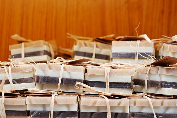 Natural layered soap bars bundled with raffia for eco-friendly artisanal packaging