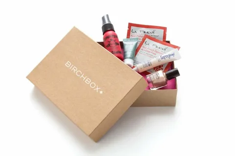 Open custom shipping box filled with skincare and cosmetic products