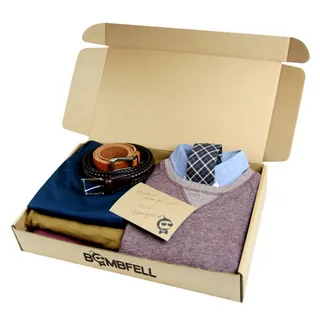Open clothing subscription box with outfit, belt, tie and personalized thank you card