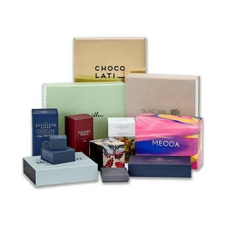 Variety of branded PR boxes from companies like Mecca, Chocolat, and Kit Cosmetics