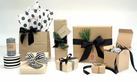 Custom gift boxes made of kraft paper with ribbons, tags, and decorative elements for retail and holiday packaging
