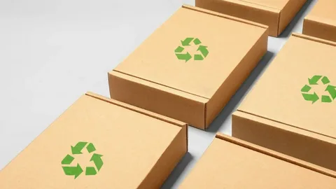 Multiple flat eco-friendly cardboard boxes with recycle symbols