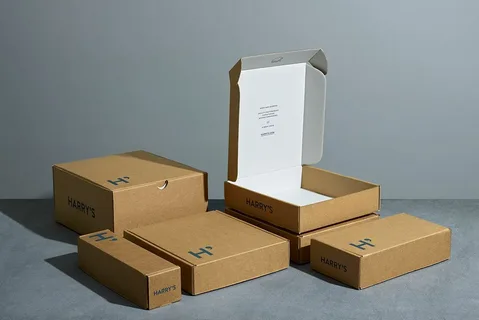A variety of flat brown cardboard mailer boxes, some open and some closed