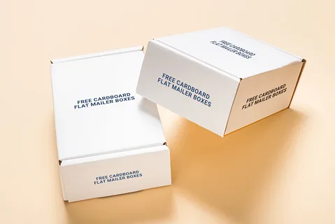 Plain white cardboard mailer boxes with printed text