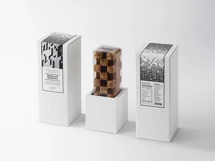 Modern granola packaging with clean white boxes and black patterns.