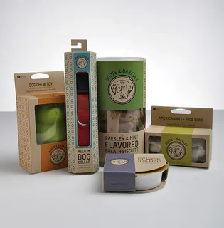 Modern pet product packaging including dog chew toy and treat boxes