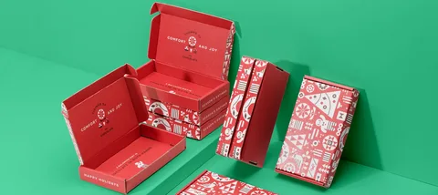 Set of custom red mailer boxes with holiday-themed graphics