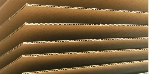 Corrugated cardboard sheets close up showing board thickness.