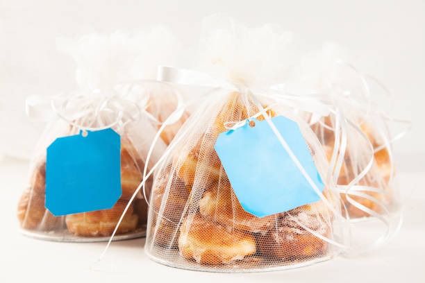 Decorative mesh bags used for packaging sweets and bakery products as part of bagged packaged goods examples.