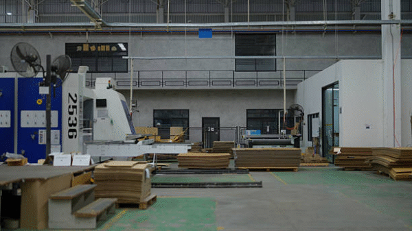 Industrial production line for processing cardboard and corrugated packaging