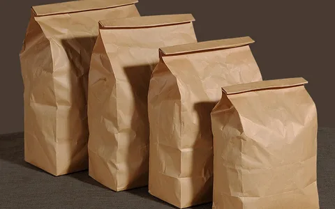 Brown kraft paper packaging bags in multiple sizes used for natural and biodegradable product packaging.