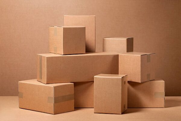 Brown kraft shipping boxes stacked together on a neutral background for packaging use.