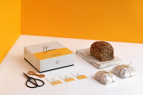 Minimalist bakery packaging with bold color contrast and uncluttered typography for artisan bread.