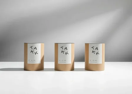 Minimalist cylindrical packaging using eco materials and clean graphic layout.