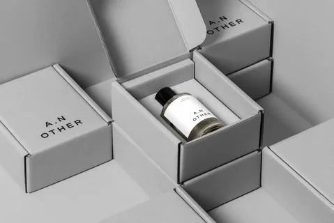 Minimalist perfume packaging with matte finish and elegant typography in neutral tones.