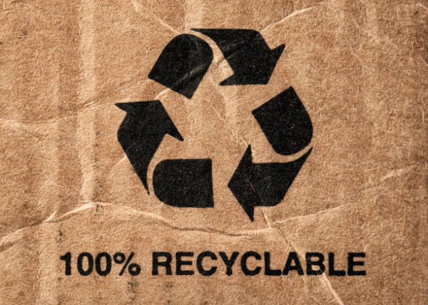 Recyclable symbol on brown carton surface emphasizing eco-friendly carton packaging materials.
