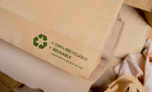 Cardboard carton labeled recyclable and reusable showing eco-friendly carton packaging approach.