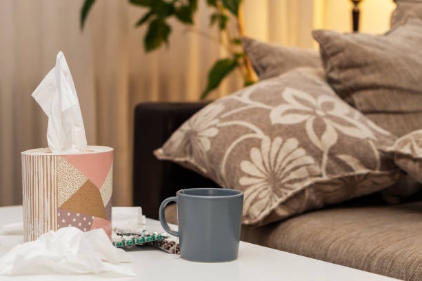 Round tissue box in living room setup as example of bad packaging design