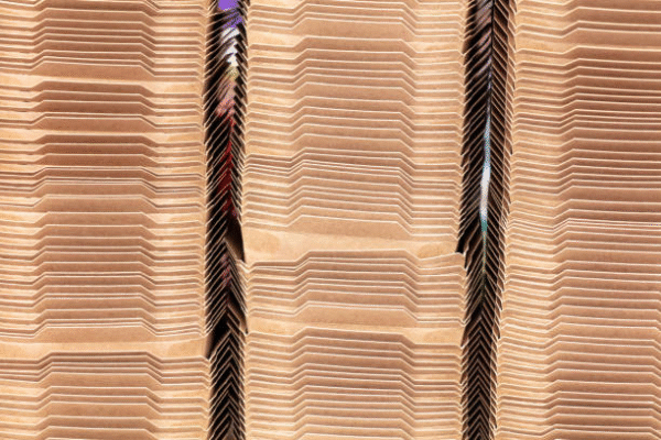Large stack of corrugated sheets showing types of corrugated boxes