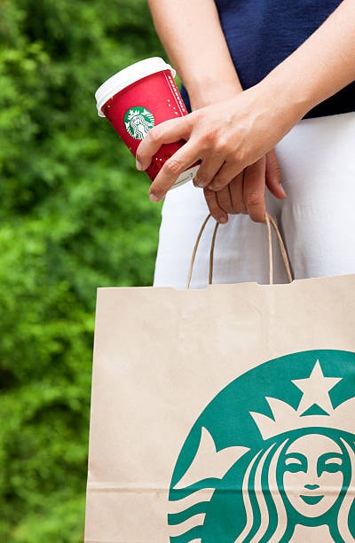 Brand packaging example of Starbucks takeaway cup and bag
