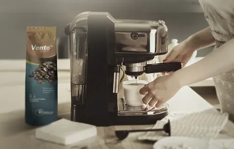 Coffee packaging beside coffee machine showing cost efficiency in branding
