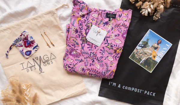 Compostable mailer and organic fabric bag used for apparel packaging, representing eco-friendly solutions in sustainable fashion.