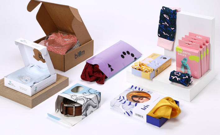 Variety of custom apparel packaging boxes displaying creative branding ideas across different clothing categories.