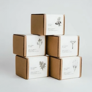 Minimalist packaging sleeve design with elegant printed artwork on kraft boxes.