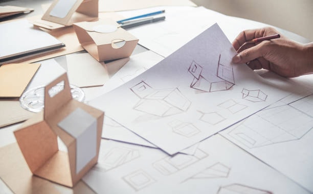 Brand packaging development process with sketches and prototypes