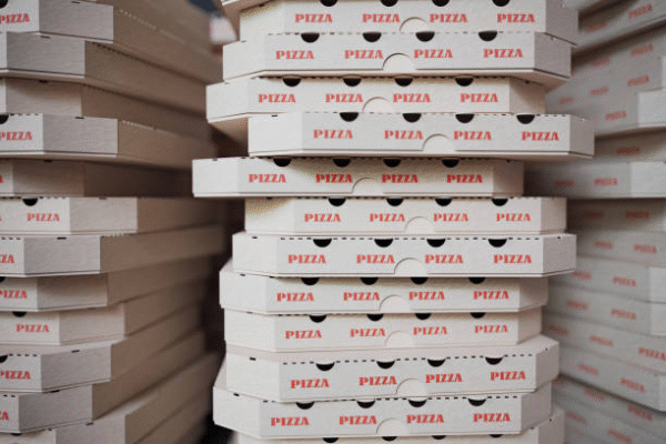 Stack of pizza boxes showing common pizza box dimensions