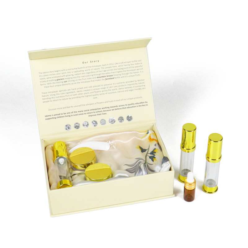 Beige rigid box with silk lining and gold-capped glass bottles, featuring brand story on inner lid—demonstrating sustainable packaging that balances material performance and emotional connection.