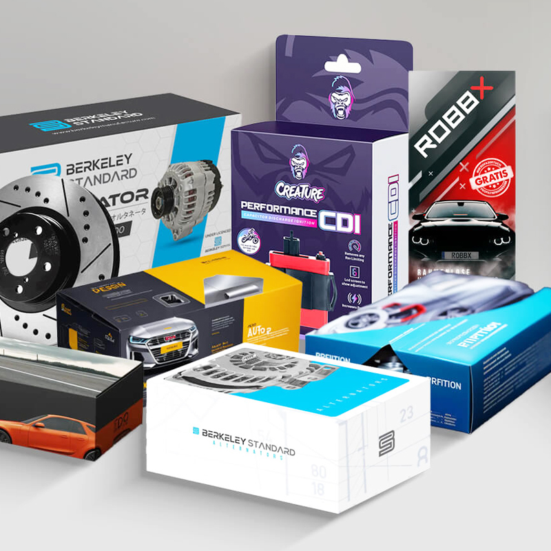 Collection of custom automotive packaging boxes for performance parts including brake rotors, alternators, and CDI units—showcasing brand-specific design and protective features.