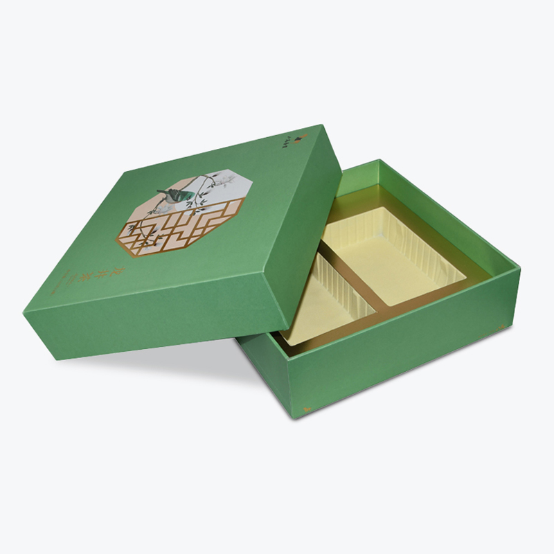 Green square gift box with traditional Chinese window pattern and bird illustration, featuring a partitioned interior liner—ideal for high-value automotive parts requiring environmental protection.