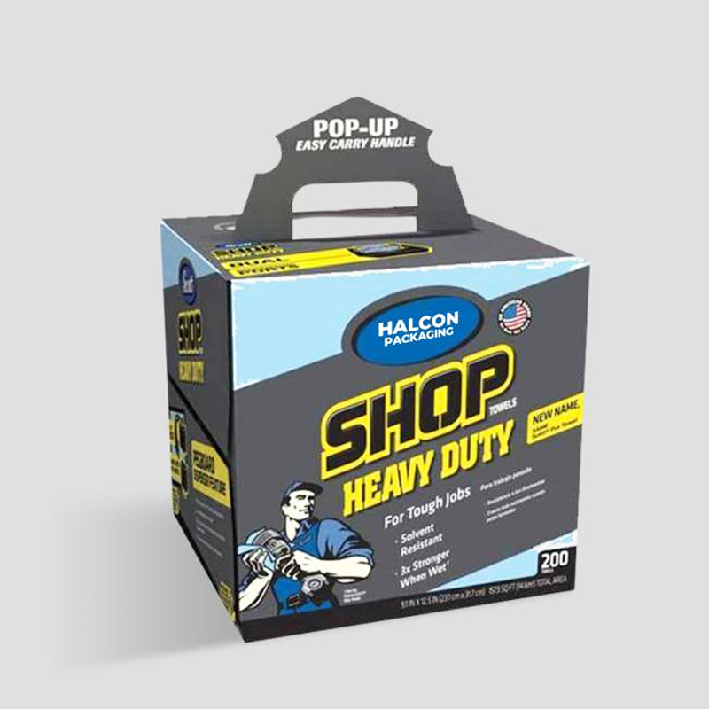 Halcon heavy-duty shop towels box with pop-up handle, featuring bold text and worker illustration—ideal for one-time use in automotive workshops.