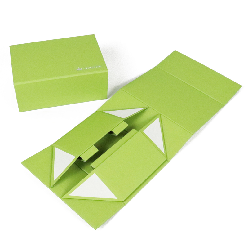 Bright green folding carton in flat-packed and open state, featuring modular compartments and die-cut structure—ideal for sustainable and scalable cosmetic packaging solutions.