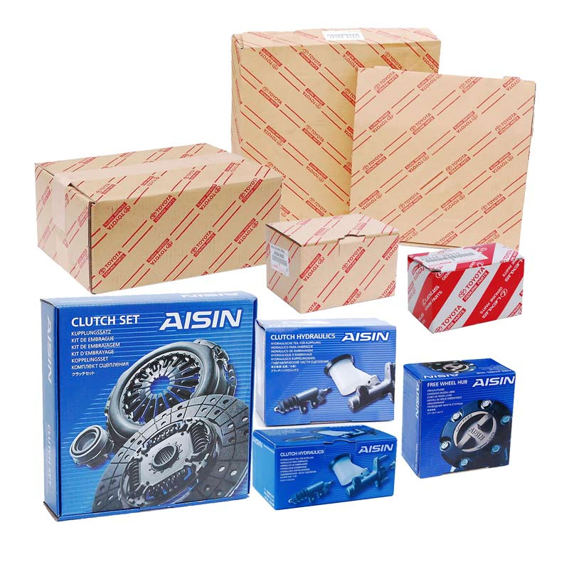 AISIN clutch set and hydraulic components in blue rigid boxes alongside Toyota-branded corrugated cartons—showcasing different packaging strategies for OEM and aftermarket parts.
