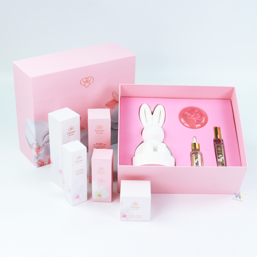 Pink rigid box with bunny-shaped silicone insert and multiple skincare bottles—showcasing functional packaging where protection and design matter more than FSC certification.
