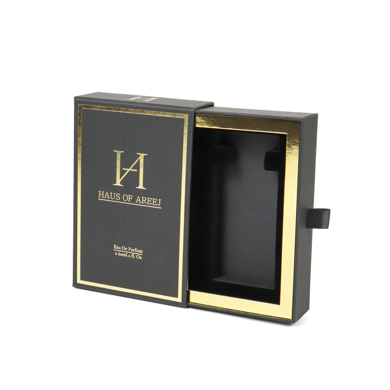 Elegant black rigid box with gold foil trim and magnetic closure, open to reveal interior compartment, demonstrating sophisticated structural design.