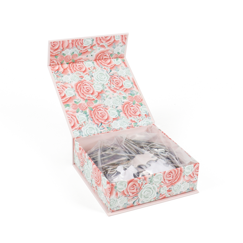 A floral-printed folding carton with a transparent window revealing packaged jewelry inside—demonstrating how vibrant designs and functional features can be achieved at lower unit costs when using scalable printing processes and efficient flat-pack shipping.