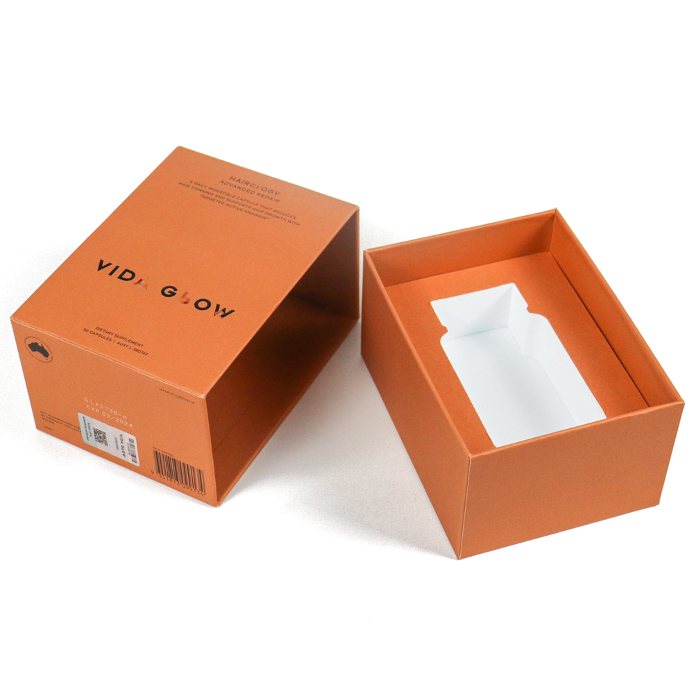 An open orange rigid box with a removable lid and custom white inner tray, designed to securely hold and display premium products like supplements or high-end accessories—emphasizing clean presentation and brand clarity.