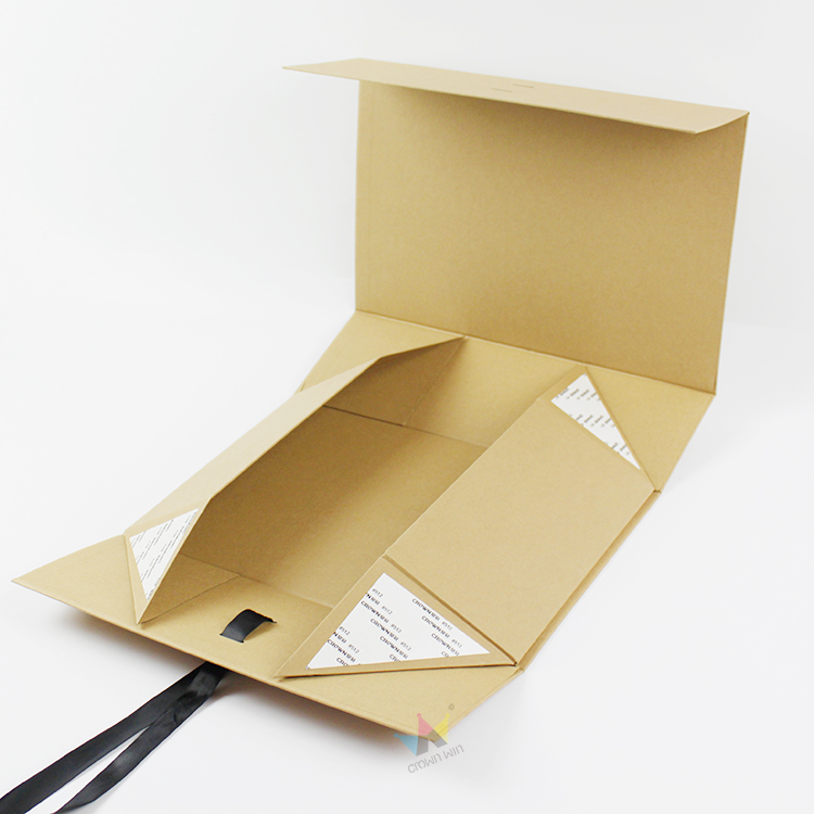 A partially assembled kraft paper folding carton showing die-cut flaps and flat-pack structure, ideal for mid-range or fast-fashion brands seeking lightweight, easy-to-store custom apparel packaging solutions.