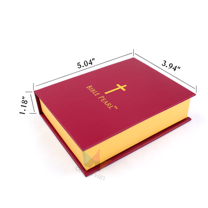 Red and gold book-style box with dimensions labeled (5.04" x 3.94" x 1.18"), featuring a gold cross logo and "BIBLE PEARL™" text, showcasing structural precision and high-end finish.