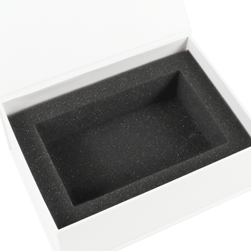 Open white rigid wine box featuring a black EVA foam insert with a precisely cut cavity designed to securely hold one wine bottle.