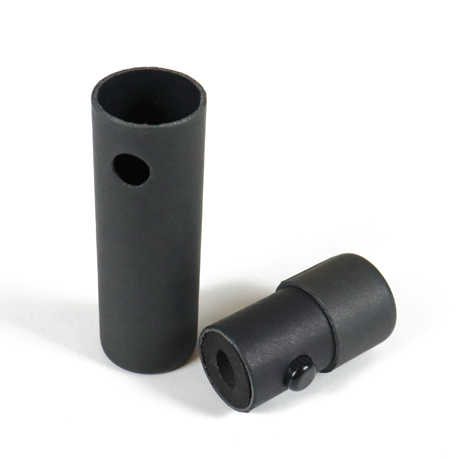 Black matte-finish cylindrical sleeve designed to hold a vape cartridge, featuring a side vent hole and removable cap for secure storage and transport.