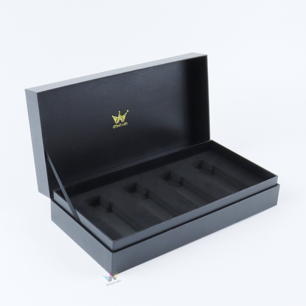 Open black rigid box featuring a gold embossed logo and custom-molded interior tray, designed to securely hold vape cartridges and prevent accidental access.