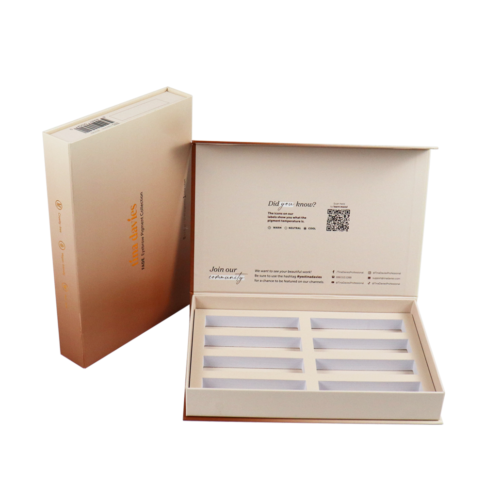 Open luxury-style box with gradient finish showing internal branding and informational text panel, demonstrating strategic layout for regulatory compliance and consumer engagement.