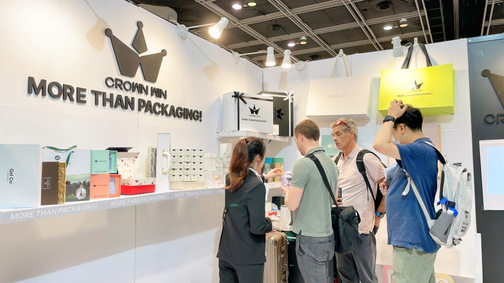 Crown Win exhibition booth showcasing custom watch packaging solutions with visitors discussing MOQ, lead time, and cost—highlighting OEM collaboration benefits.