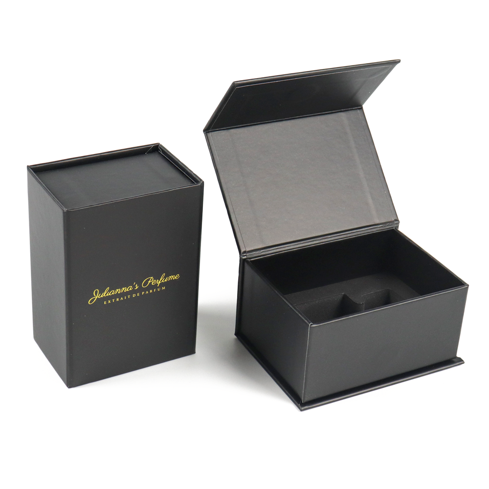 Two black rigid boxes, one closed with gold foil logo reading "Julanna's Perfume", the other open showing inner foam insert and structured interior.